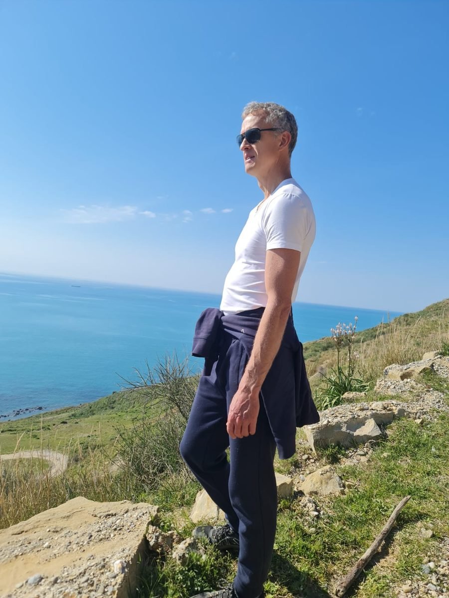 Ludolf standing on a clifftop above the Albanian coast