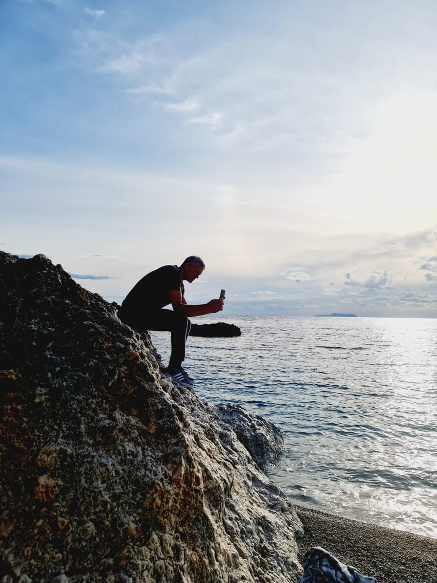 Ludolf photographing the Albanian coastline from the rocks