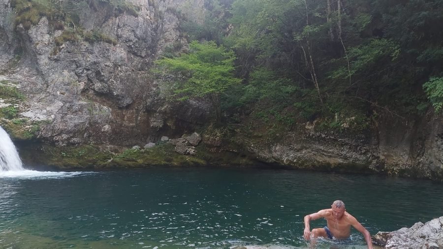 Ludolf swimming in a waterfall pool in Albania