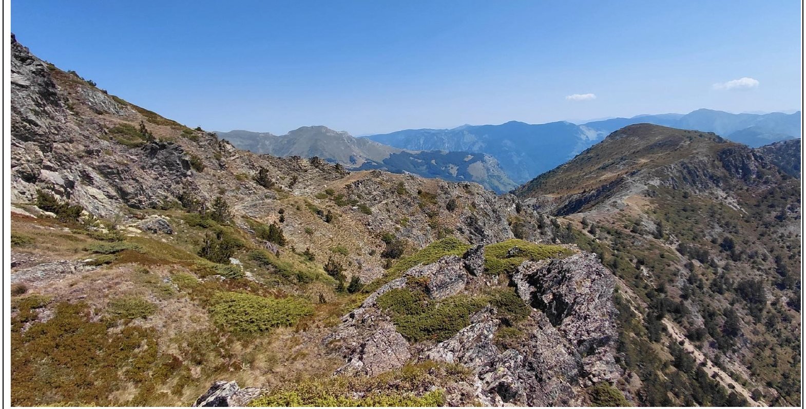 Rocky ridgeline above Vermosh with distant mountain views